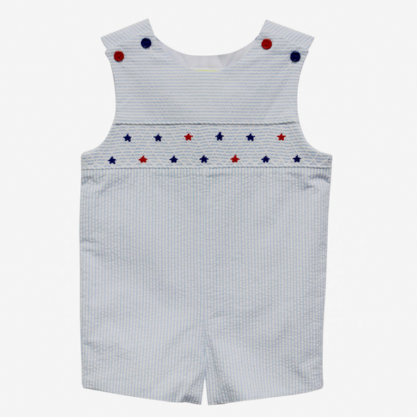 Light blue and white seersucker Jon Jon with red and blue star smocking on chest and coordinating red and blue buttons at the shoulder.