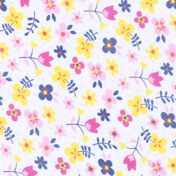100% pima cotton Magnolia Baby floral fabric. Close of of blue, pink, and yellow floral print.