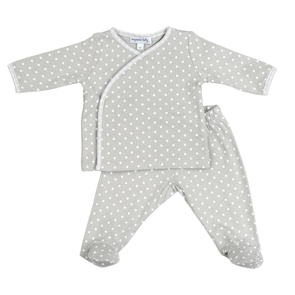 Magnolia Baby 2 piece baby set with footed pants and cross-over long sleeve top. Features 100% pima cotton fabric and silver and white dot print. Perfect coming home outfit!