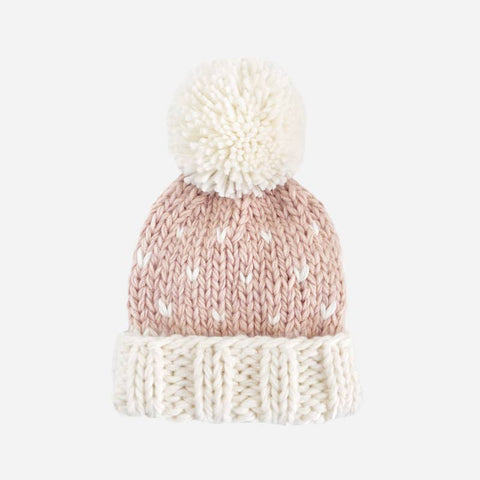 Cream hand-knit hat with cream pom on the top. Accented by multiple fall/winter color pompoms on the body of the hat.