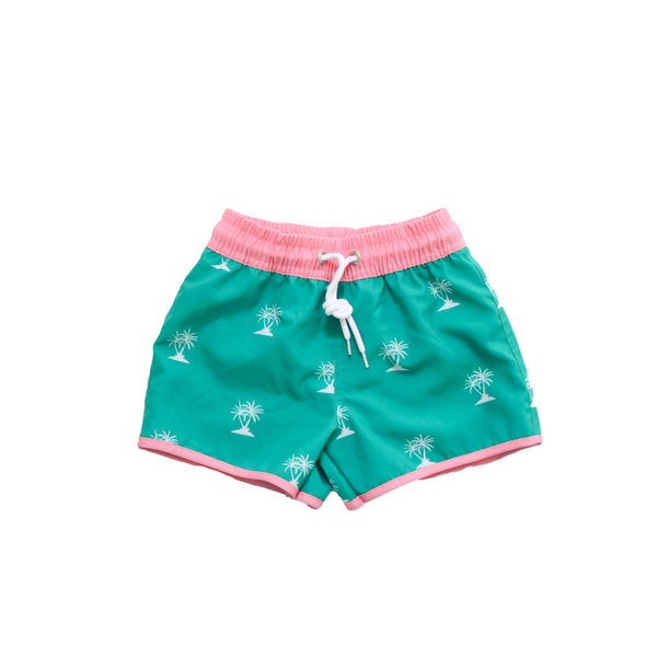 Green swim trunks with palm trees and pink trim