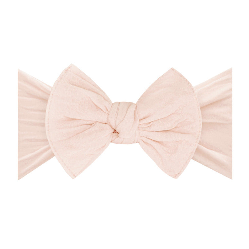 Light pink petal Baby Bling Bow knot headband. The most comfortable baby bow headband that doens't leave marks on baby's head! 