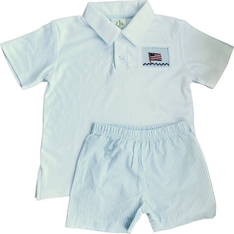 White polo with flag embroidery and coorinating blue and white seersucker woven shorts. Perfect boy's outift for 4th of July or other patriotic occasions! 