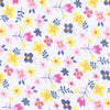 100% pima cotton Magnolia Baby floral fabric. Close of of blue, pink, and yellow floral print. 