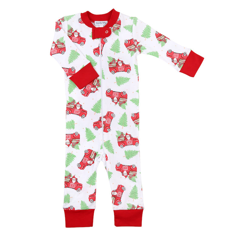 Magnolia Baby Christmas pajamas with santra, tree, and red truck print. Made of 100% pima cotton. Perfect for Christmas morning!                     
