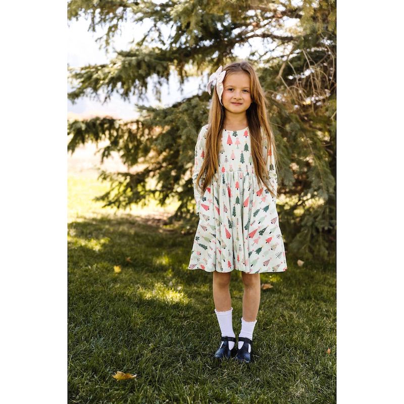 Gorgeous twirly dress with festive red and green Christmas tree print. Perfect to dress up or dress down for all your holiday occasions. 